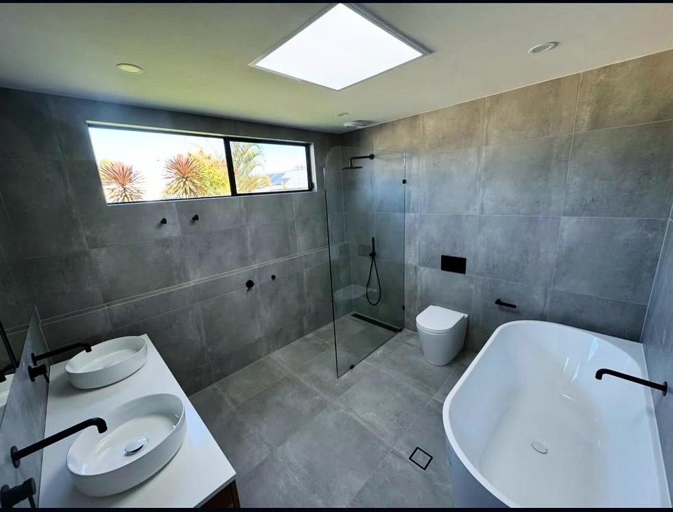 Contemporary bathroom with double vanity and black fixtures